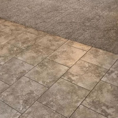 Tile to carpet flooring transition from Kluesner Flooring in Delhi, IA